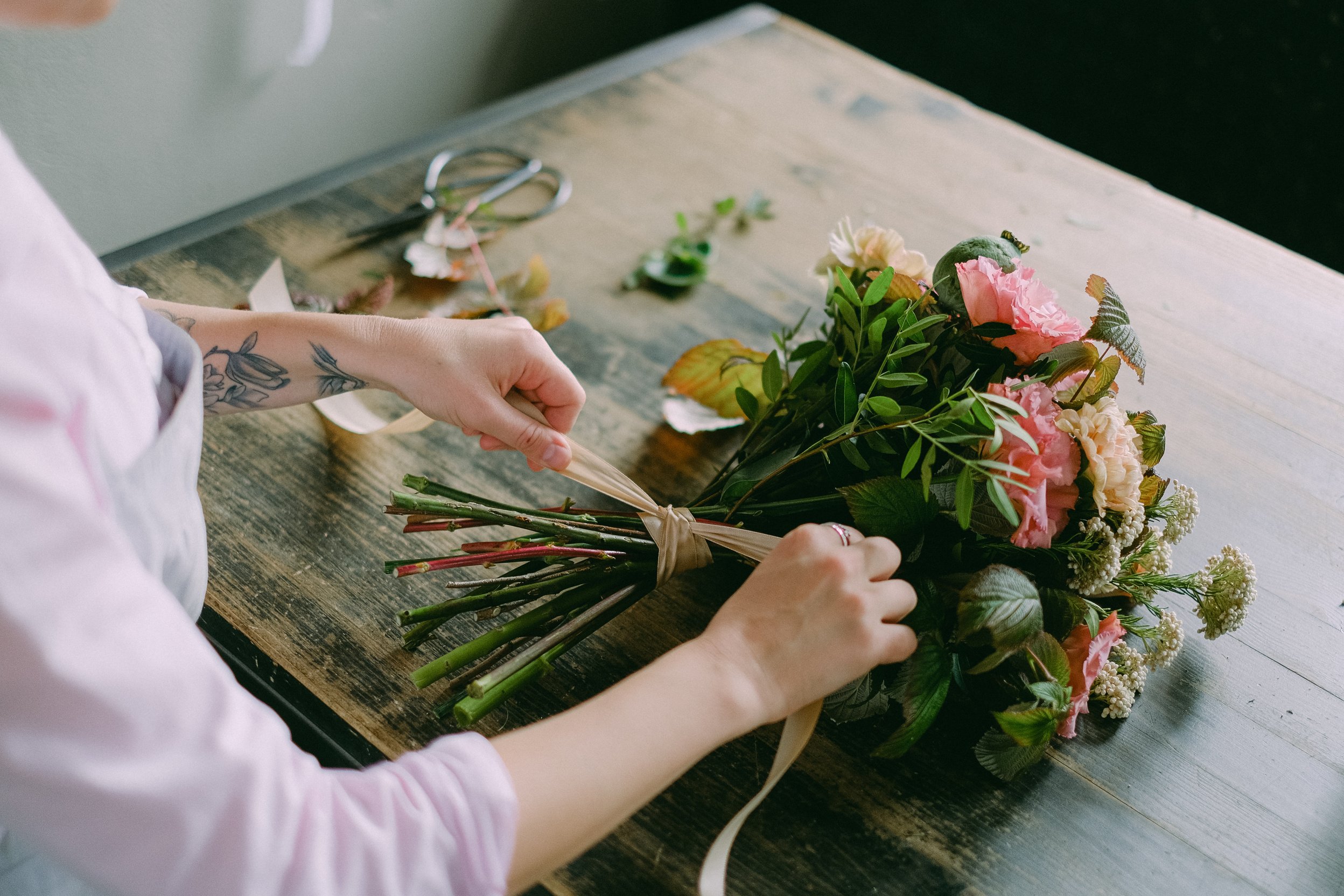 Person Holding Bouquet of Flowers